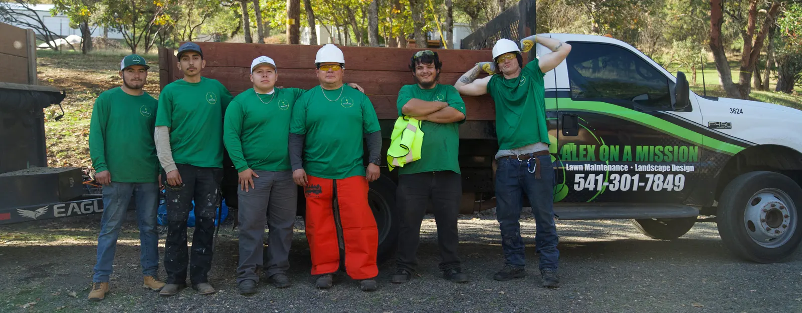 The Alex On A Mission crew in front of the company truck